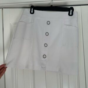 Women’s white golf skirt with silver/grey buttons